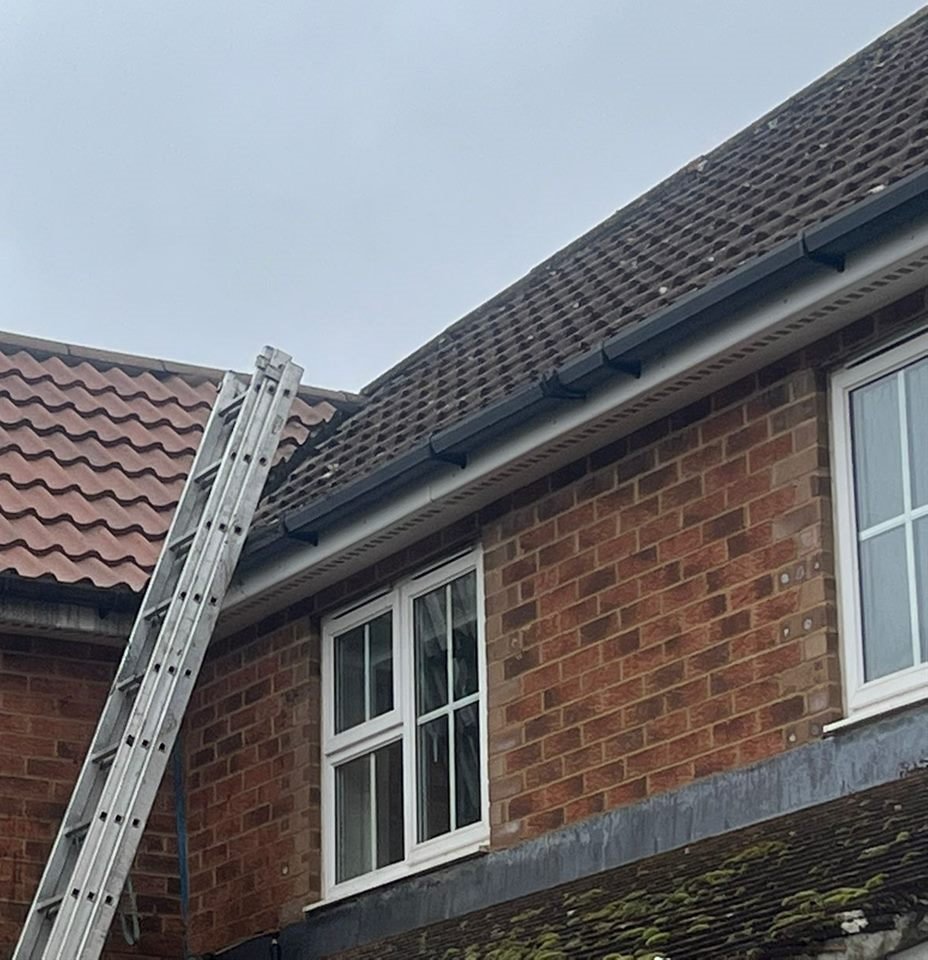 Gutter being cleared (before/after)