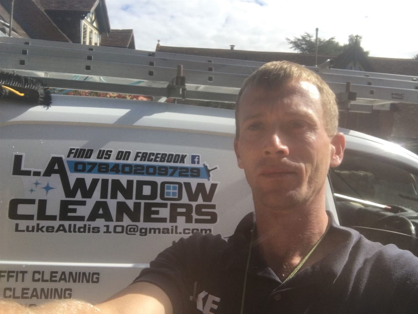 Luke Alldis, owner of L.A. Window Cleaners, with the branded van